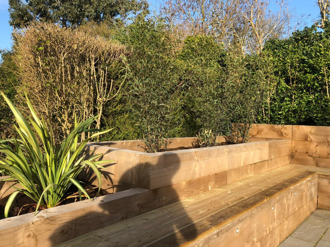 Photo of Raised planting beds with railway sleepers after professional installation