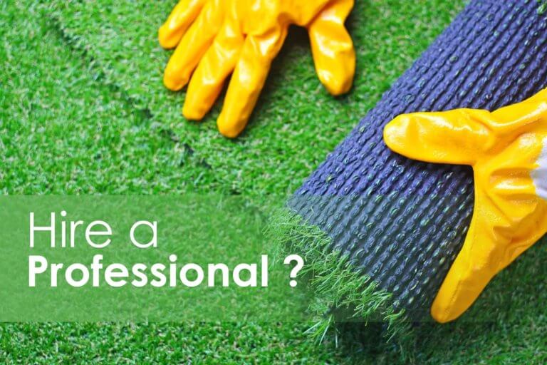 yellow-gloves-rolling-out-artificial-grass